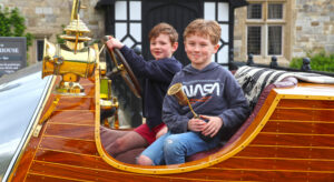 Children enjoying rides in Chitty Chitty Bang Bang around the Beaulieu attraction this May half-term