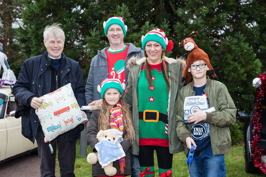 Lord Montagu with the Hale family, winners of best dressed family and dog