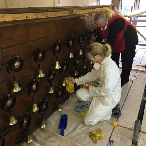Sarah Downer and Hannah Broughton buff the bells