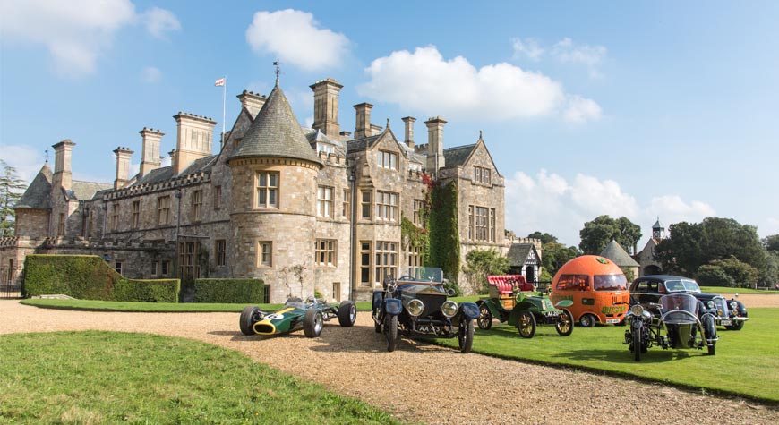 Historic vehicles from the National Motor Museum outside Palace House