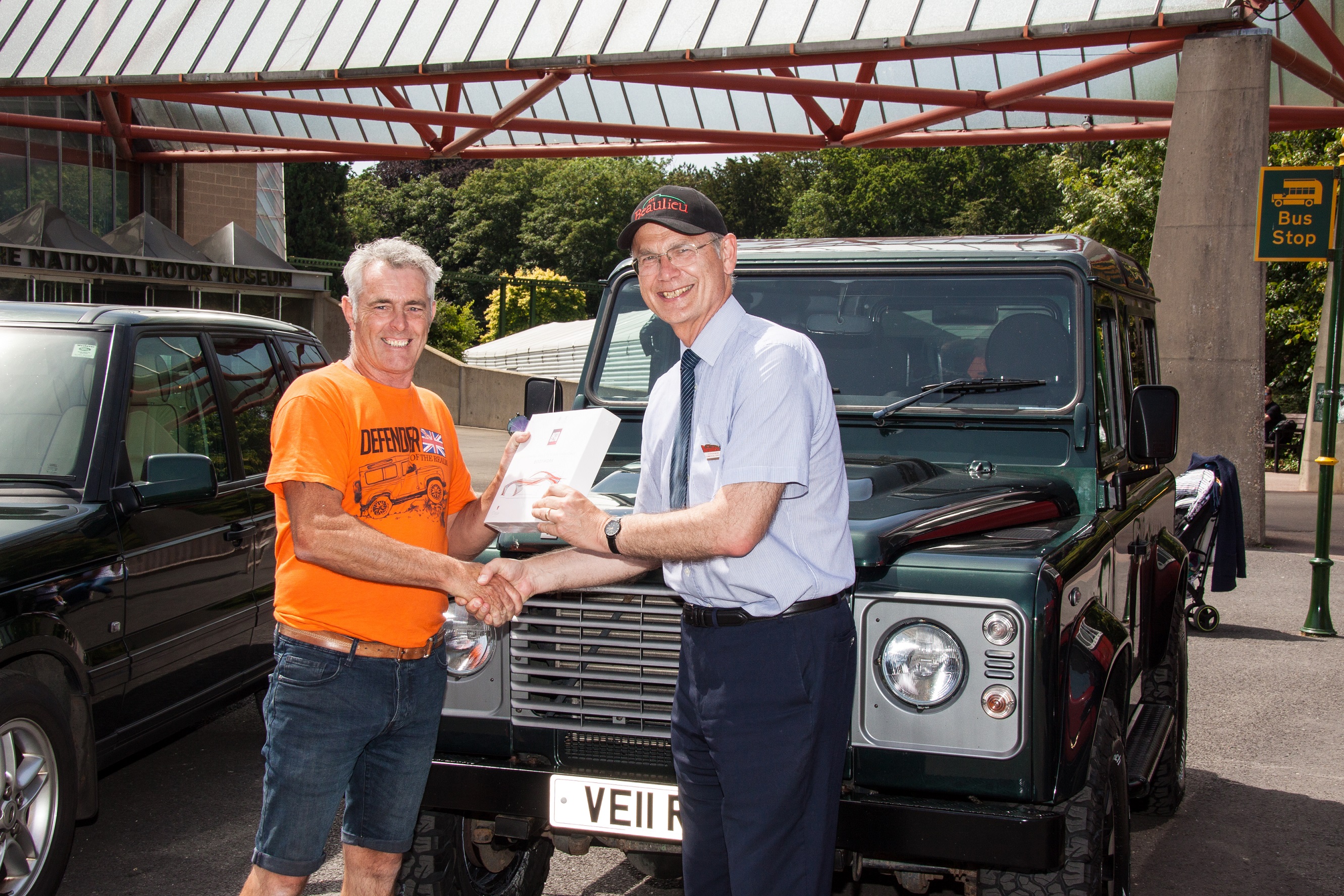 Simply Land Rover People's Choice runner up Michael Smith being presented with prize by Beaulieu Commercial Director Steve Munn