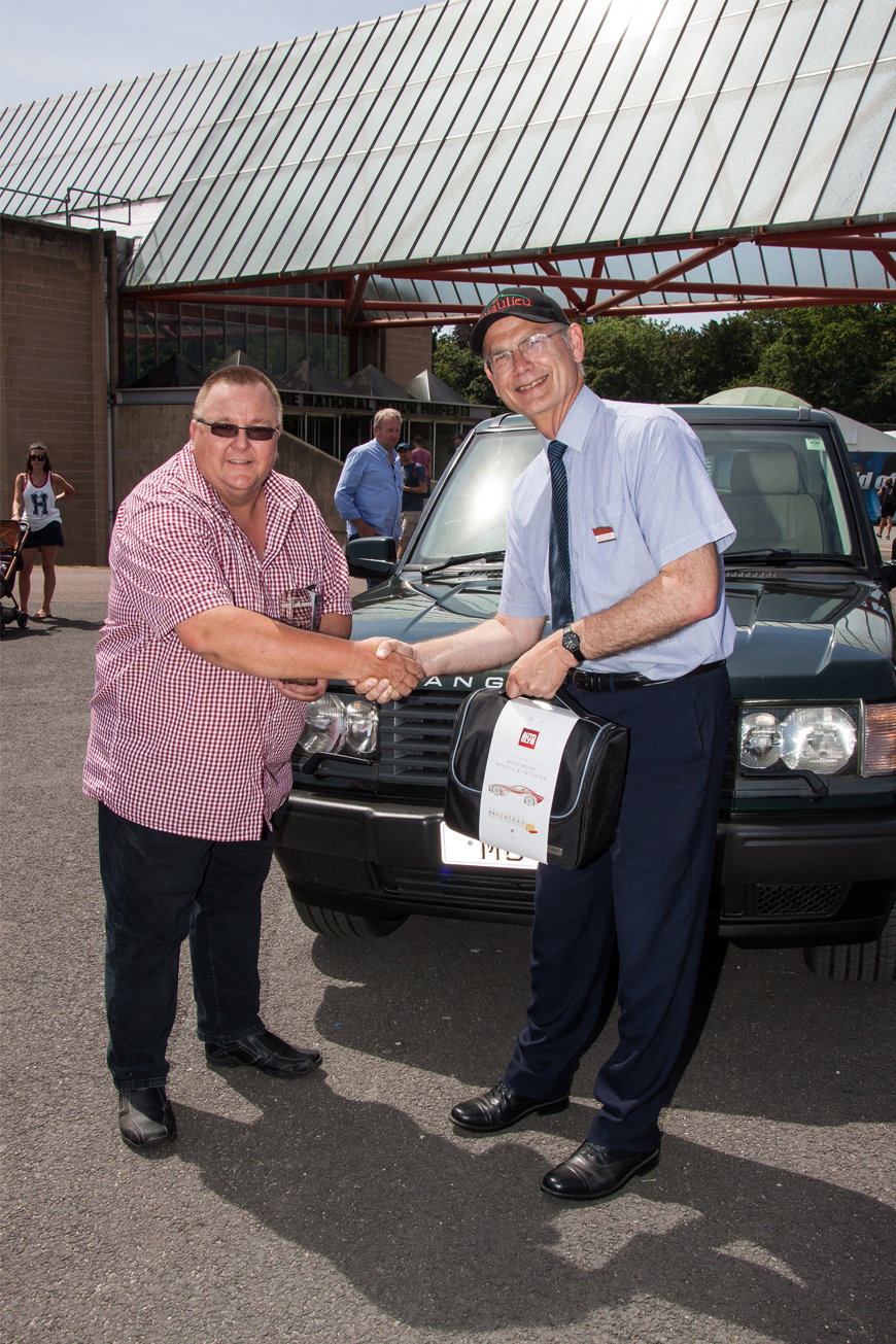 Simply Land Rover People's Choice winner Gary Williams being presented with prize by Beaulieu Commercial Director Steve Munn