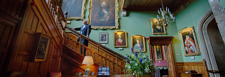 Butler on the staircase in Palace House