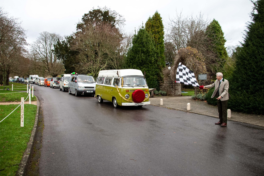 Lord Montagu waves start flag for the VW Santa Run