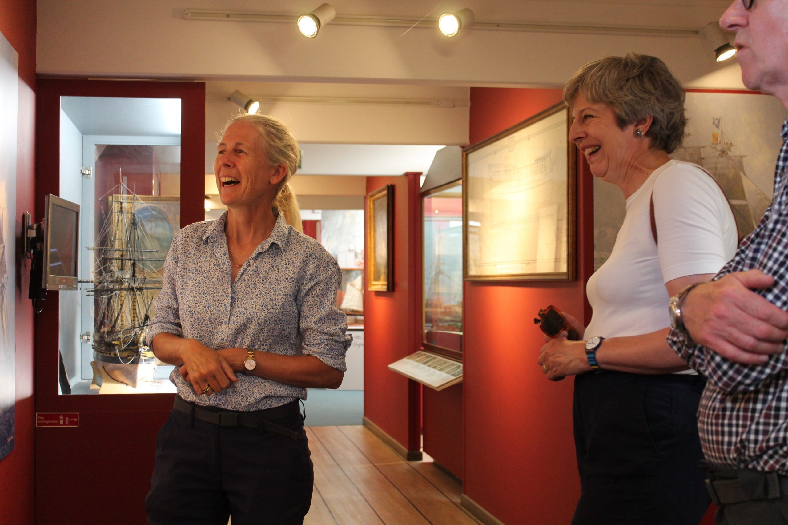 Mary Montagu-Scott shows Theresa and Philip May around the Maritime Museum at Buckler's Hard