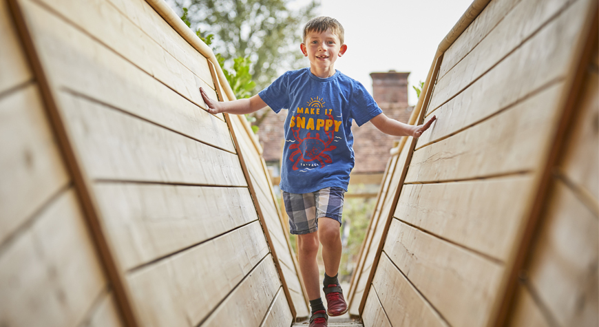 Child having fun in Little Beaulieu