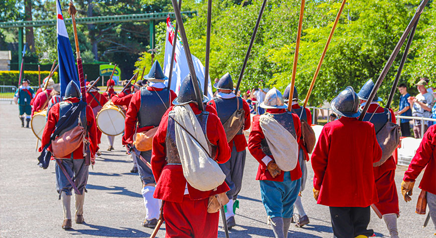 Re-enactors marching through the Arena