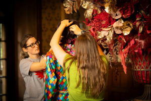 Decorating begins on one of the Masked Harlequins of A Palace House Christmas