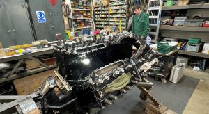 Apprentice Aaron Burton with Sunbeam's second restored engine in the National Motor Museum workshop