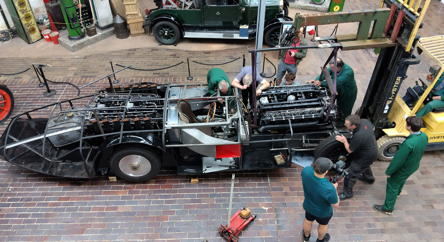 Lowering restored second engine into Sunbeam 1000hp chassis in the National Motor Museum