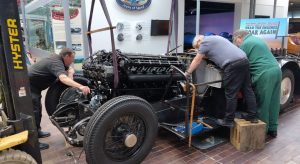 National Motor Museum Chief Engineer Doug Hill (left) and Senior Engineer Ian Stanfield (centre) fit second restored engine in Sunbeam 1000hp