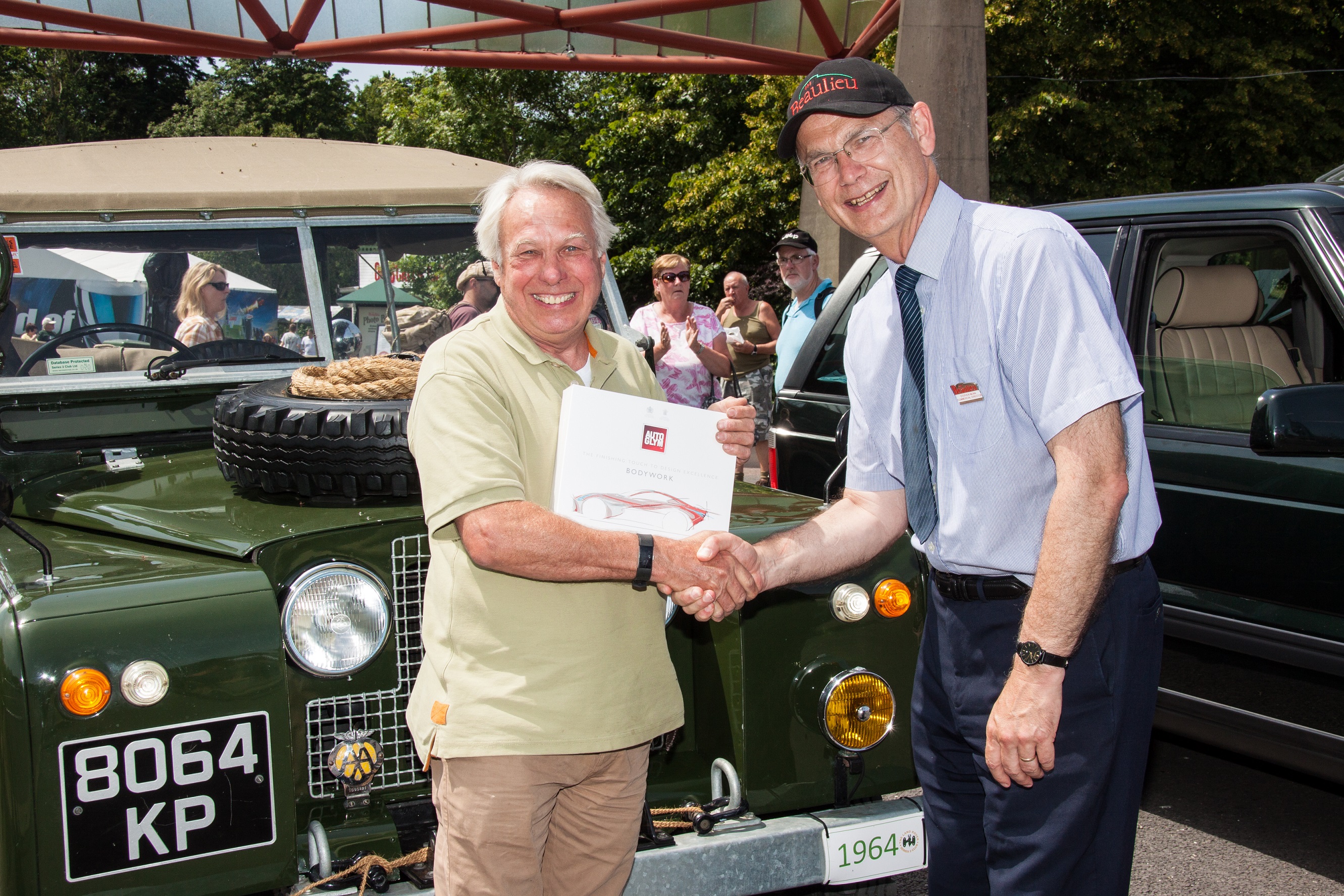 Simply Land Rover People's Choice runner up Christopher Pendred being presented with prize by Beaulieu Commercial Director Steve Munn