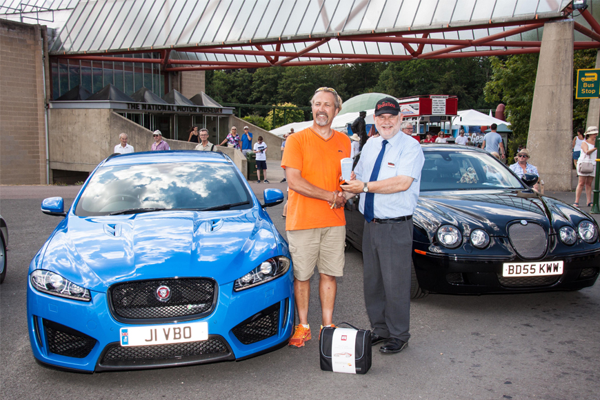 Simply Jaguar People's Choice Winner Jim Bradford is presented with his trophy by Beaulieu Managing Director Russell Bowman