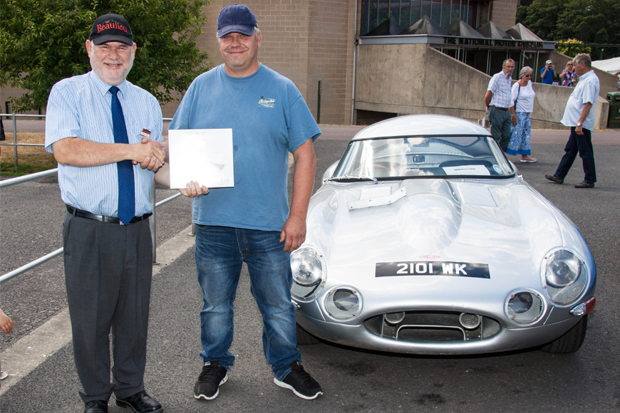 Simply Jaguar People's Choice runner-up Malcolm Watson is presented with prize by Beaulieu Managing Director Russell Bowman