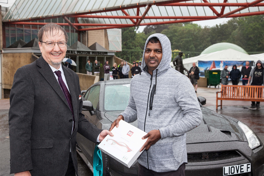 Simply Japanese People's Choice runner up Savontharam Jeganathan is presented with Autoglym prize by Beaulieu Financial Director Phil Johnson