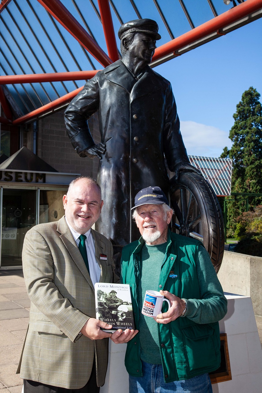 Desktop-news-Russell Bowman presents Trevor Godson with gifts beside Edward, Lord Montagu's statue-(870x1305)